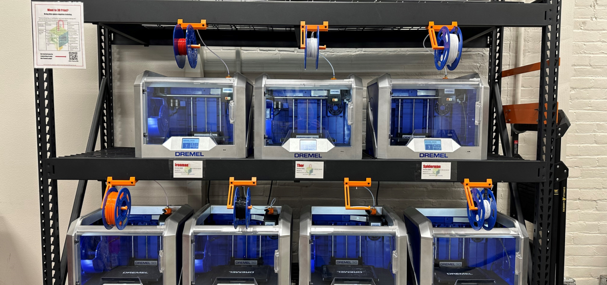 A picture showing our 7 Dremel 3D40 printers on the Tier 1 shelf.